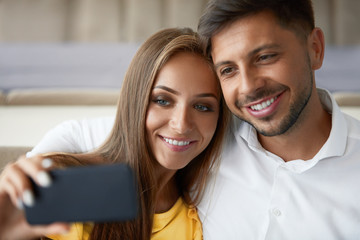 Happy Couple. Smiling Couple Taking Photo In Restaurant.