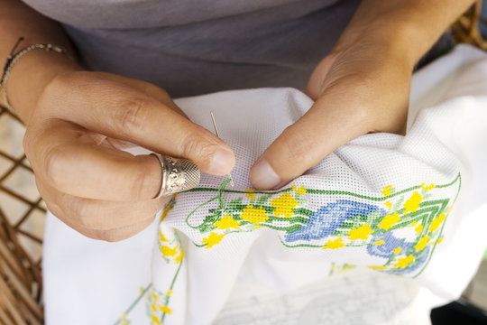 woman sewing by hand