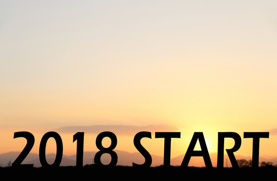 2018 START text on Sunset background.Concept Start New Year © kathayut