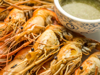 Close up image of Grilled shrimps with Thai culture seafood sauce