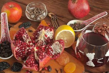 Ripe pomegranate fruits on the background of an old board