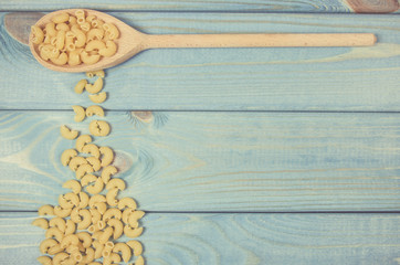 Pasta on wooden background. Diet and food concept.