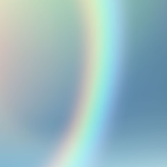 a strip of a rainbow on a cloudy sky