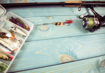 Obraz na płótnie Canvas Fishing equipment. Spinning method. A place for an inscription.