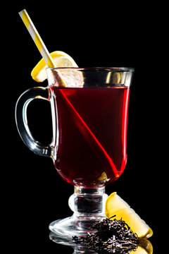 Hot cocktail with lemon, cherry juice and Assam tea