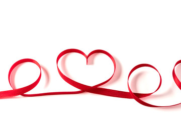 Heart made of ribbon on white background. Valentines day.