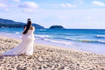 Fototapeta na wymiar Bride and groom. Relax on beach. Wedding day