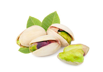 Pistachios with leaves isolated on white background