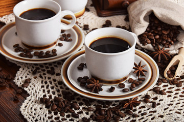 cups of coffee and milk and roasted coffee beans