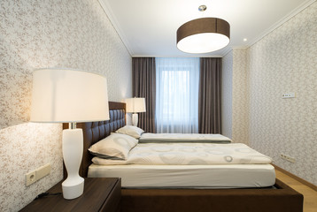 Modern Interior of the bedroom in the apartment..