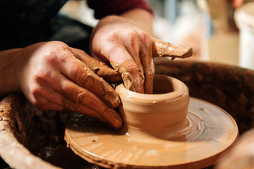Potter at work. Workshop place.