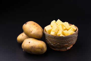 Chopped potato in a bowl isolated on a white background