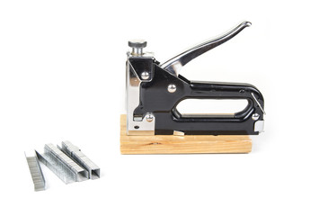 Heavy duty staple gun with staples on the white background