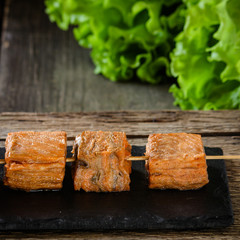 smoked (salted) red fish - salmon served on a salad leaf