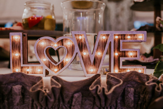 Wooden shiny love letters decorative gadget for wedding table.