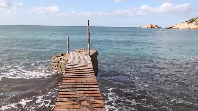 Jetty and Pier at Cala Hort Cove Beach, Ibiza, Spain