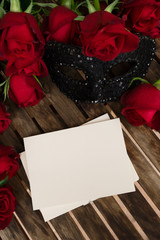 Valentines Day date invitation with roses and lacy masque, copy space on empty card
