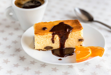 Traditional Polish homemade cheesecake with raisins and chocolate.