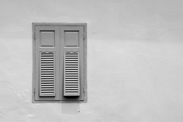 antique wood window at concrete building
