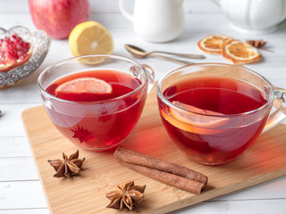 Hot homemade lemonade with pomegranate, lemon and winter spices