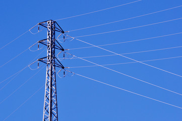 high voltage tower, cables and blue sky