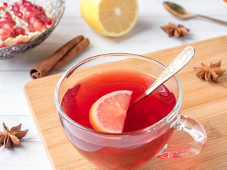 Hot homemade lemonade with pomegranate, lemon and winter spices