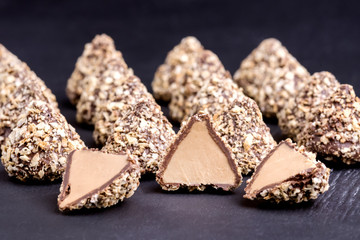 Homemade Fresh Truffle With Cocoa and Peanut Butter Close up Black Background Horizontal