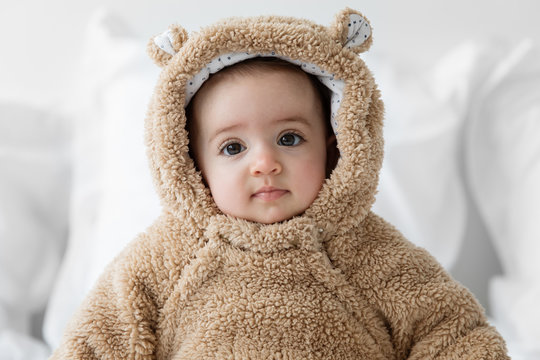 cute baby wearing hodded bear suit