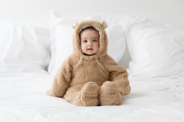 cute baby wearing bear suit