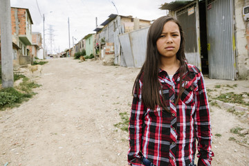 Portrait of beautiful girl in shanty town.