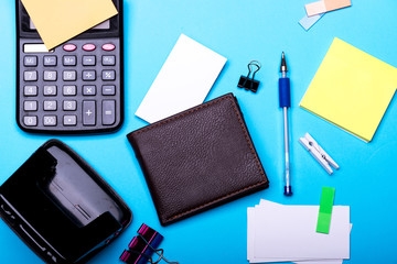 Business card and binders near sticky notes. Business accessories