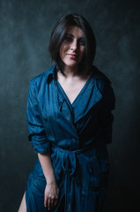 Beautiful brunete women portrait in studio on dark background