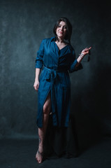 Beautiful brunete women portrait in studio on dark background