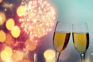 Champagne glasses on sparkling background