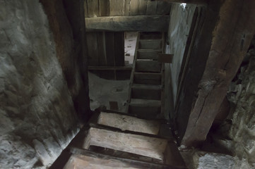 Stairs and underground cellar in old medieval tower