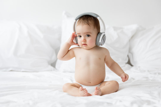 Baby listening to music with headphones
