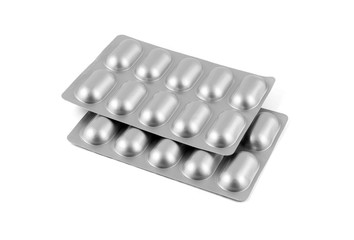 Medicine pills in aluminum foil strip isolated on white background.