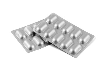 Medicine pills in aluminum foil strip isolated on white background.