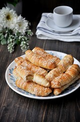 On a wooden table on a platter fresh bananas baked in a dough