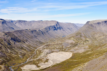 Beautiful valley. Khibiny Mountains, Kola Peninsula, Russia. View from mount Kukisvumchorr. Vudyavriok Valley. Poachvumchorr Ridge