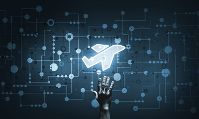 Airplane glowing icon touched with finger as online booking concept