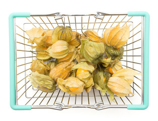 Physalis berries in a shopping basket isolated on white background top view.