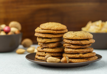 freshly baked chocolate chip cookies on a table with blurred background.