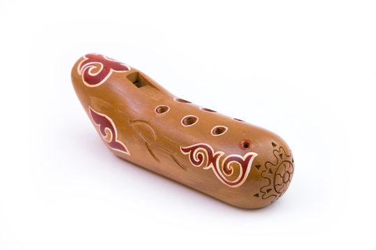 Kazakh traditional sazsyrnai. 
Closeup of a sazsyrnay - kazakh traditional ocarina isolated on white background