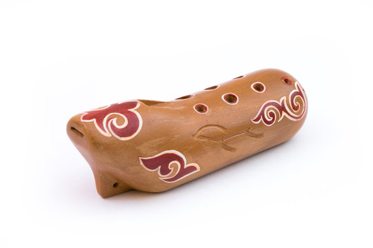 Kazakh traditional sazsyrnai. 
Closeup of a sazsyrnay - kazakh traditional ocarina isolated on white background