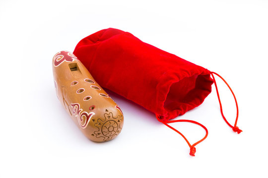 Kazakh traditional sazsyrnai. 
Closeup of a sazsyrnay - kazakh traditional ocarina isolated on white background