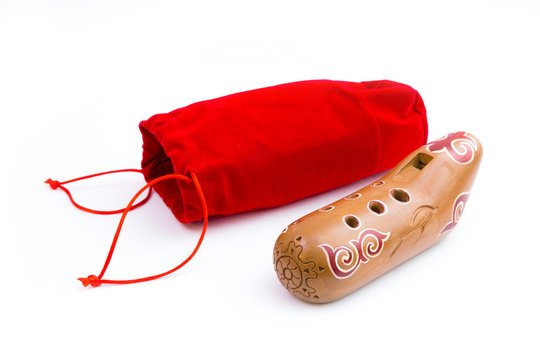 Kazakh traditional sazsyrnai. 
Closeup of a sazsyrnay - kazakh traditional ocarina isolated on white background