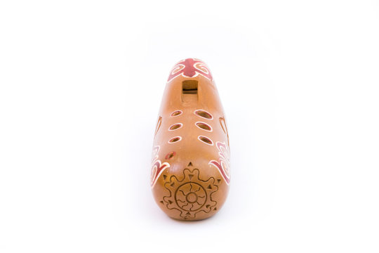 Kazakh traditional sazsyrnai. 
Closeup of a sazsyrnay - kazakh traditional ocarina isolated on white background