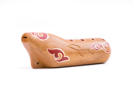 Kazakh traditional sazsyrnai. 
Closeup of a sazsyrnay - kazakh traditional ocarina isolated on white background