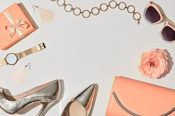 Fashion. Woman Accessories Set. Trendy Gold Heels, Watch, Summer Sunglasses, Glamour fashion Pink Clutch. Flower. Flat lay. Luxury Stylish Spring lady